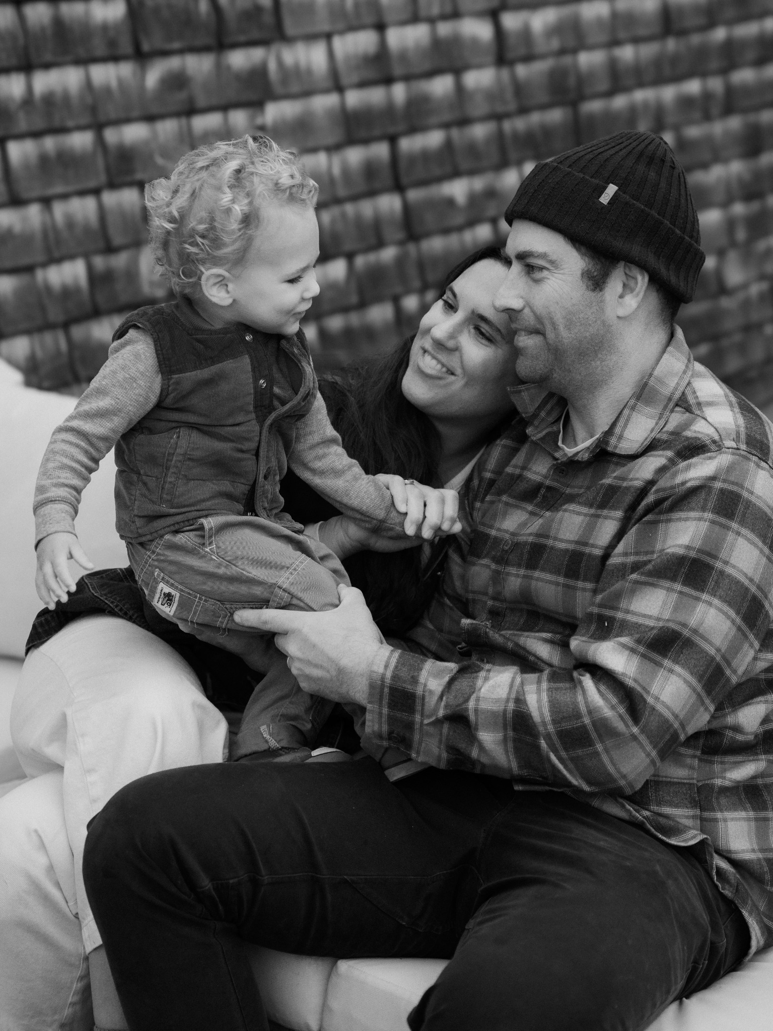 Parents smiling with their young child